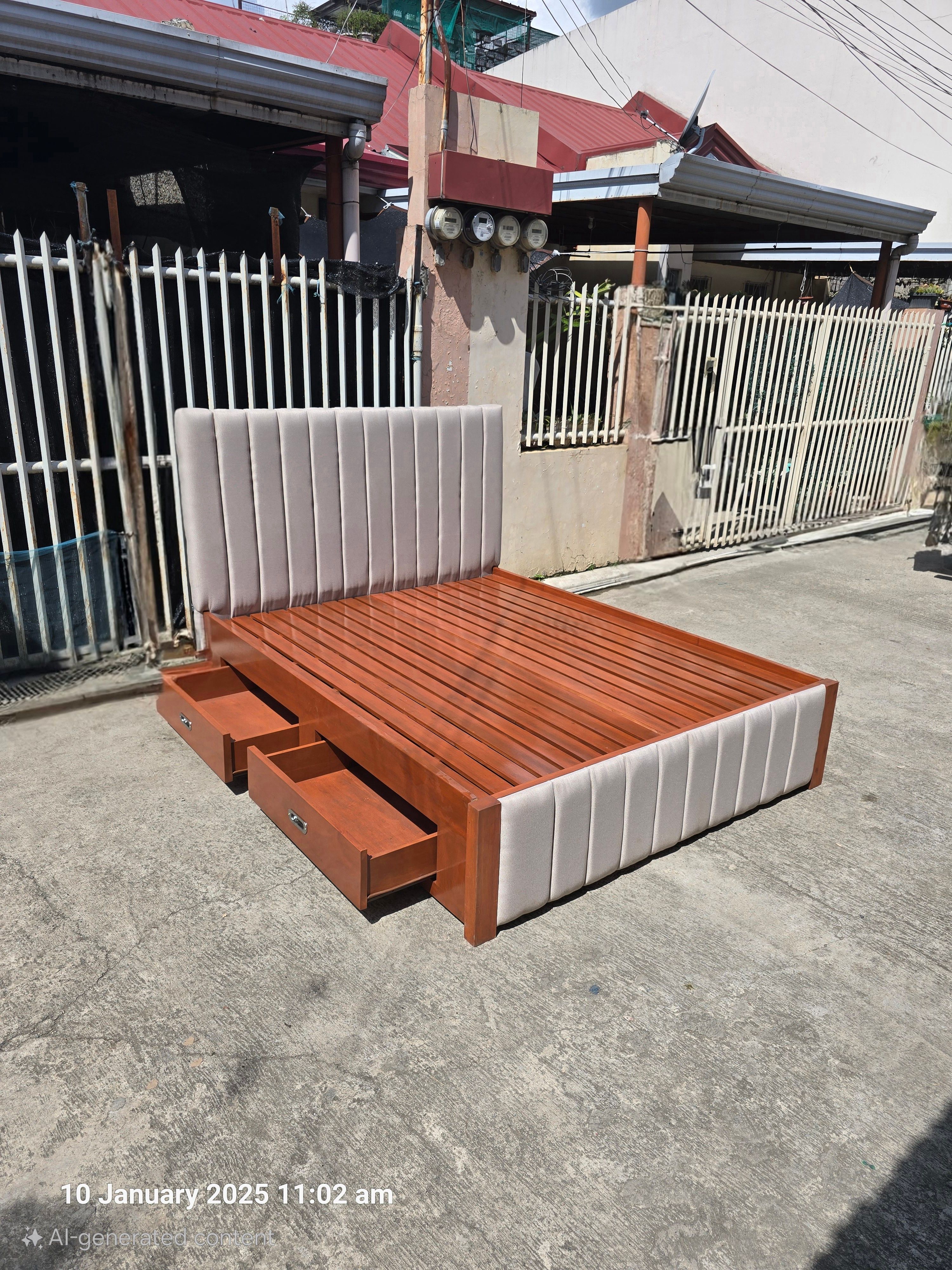 A two-tone bed that pairs a warm cherry wood frame with soft light gray channel-panel upholstery. Four built-in side drawers and a sturdy slatted base give you plenty of storage and firm mattress support.