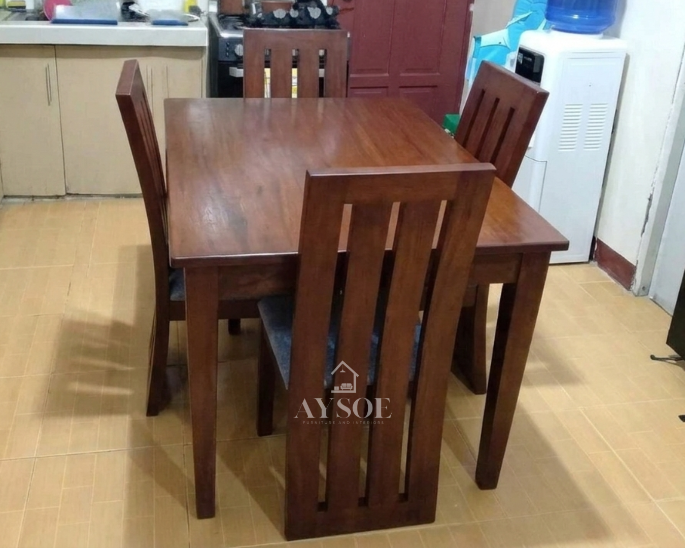 A 4-seater dining set with a solid wood table and four tall slatted-back chairs with cushioned seats, finished in a deep mahogany tone. Sturdy, easy to clean, made to order.