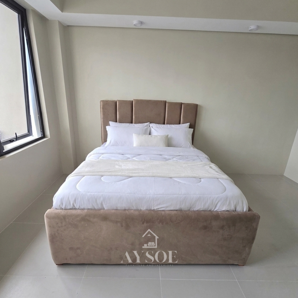 Modern bed with a high, vertically paneled channel-tufted headboard. Available in various sizes, in fabric or leather, with optional storage or pull-out.