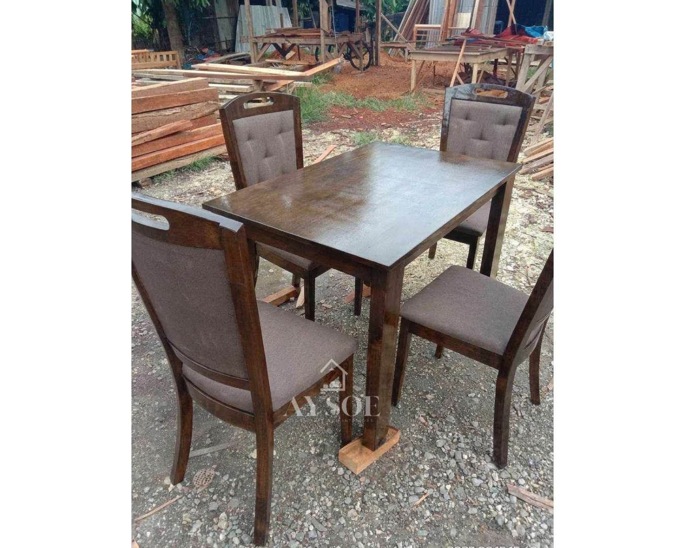 A 4-seater dining set with a solid wood table in a deep walnut finish and four upholstered high-back chairs with padded seats. Sturdy, comfortable, made to order.
