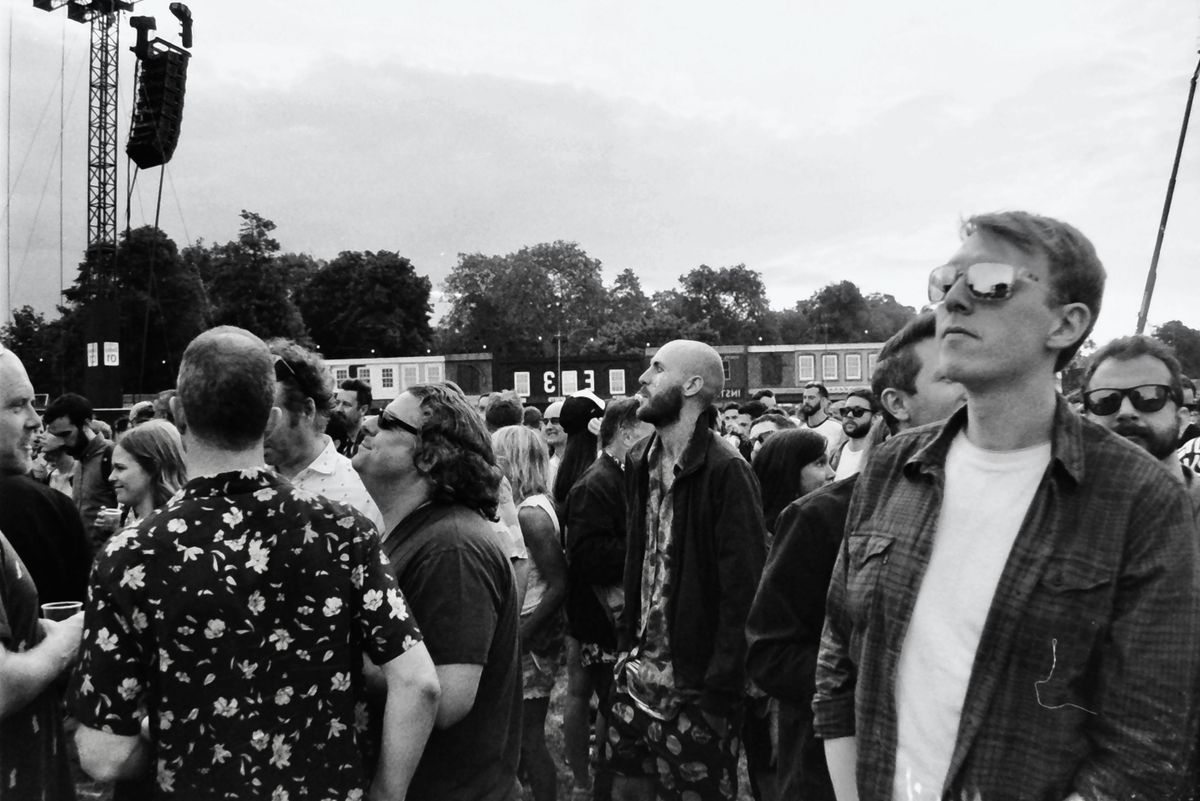 Festivalgoers gathered at an outdoor music festival in England