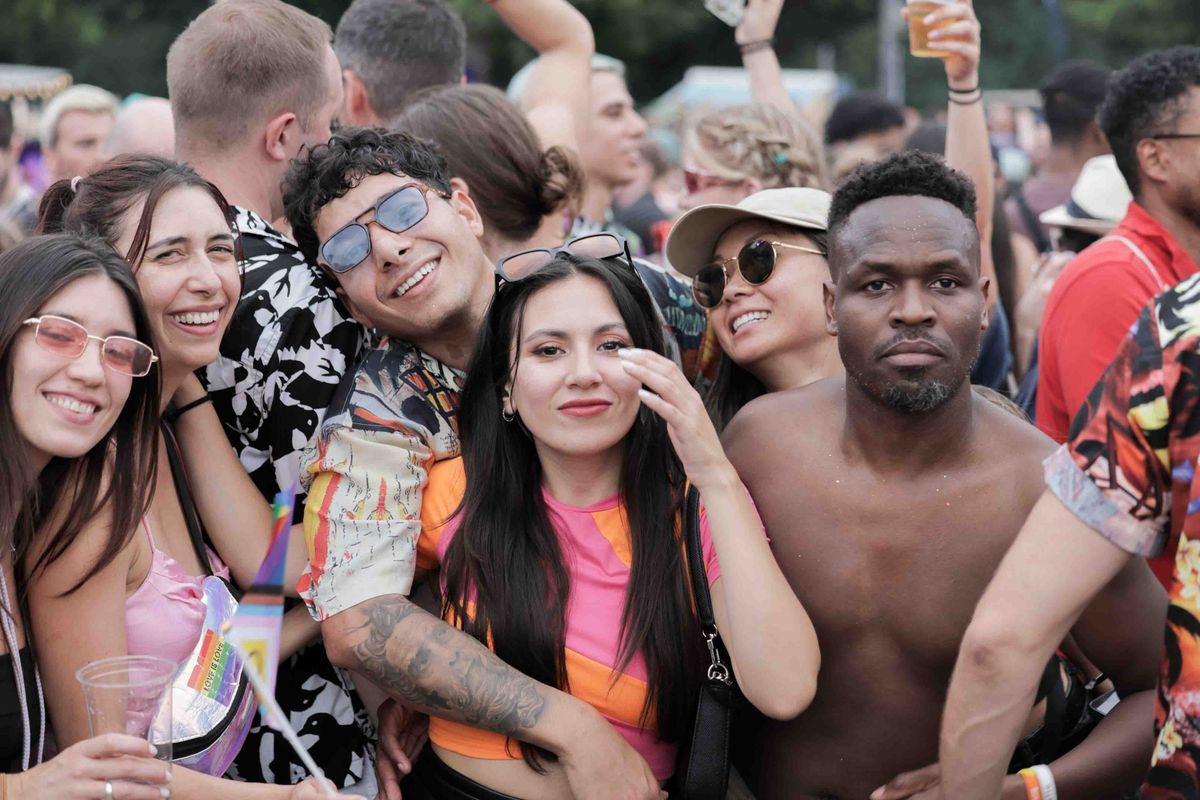 A diverse group of friends enjoying an outdoor music festival together