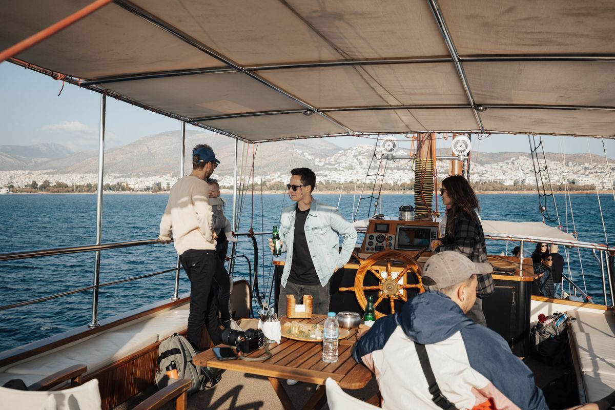 A group of friends relaxing together on a yacht in summer