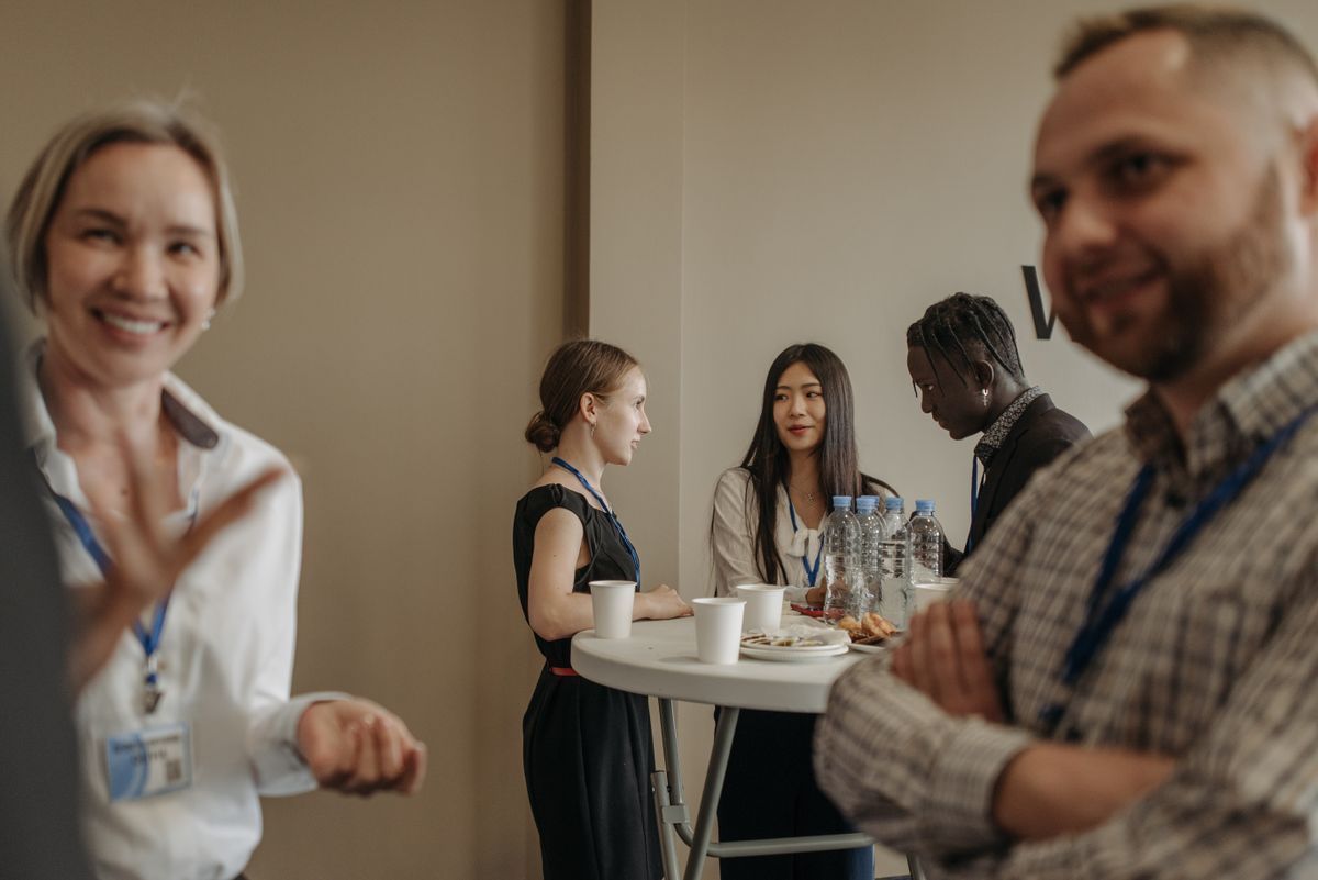 Conference attendees talking together during a networking break
