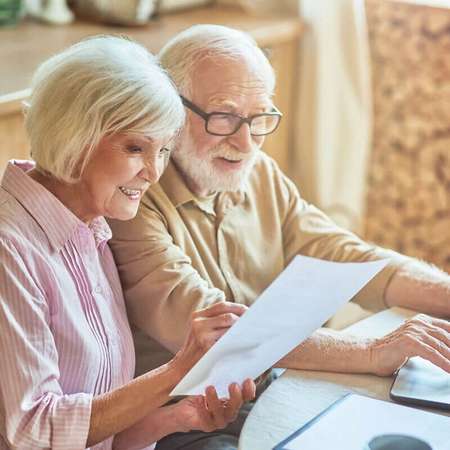 Pensioners looking at paperwork