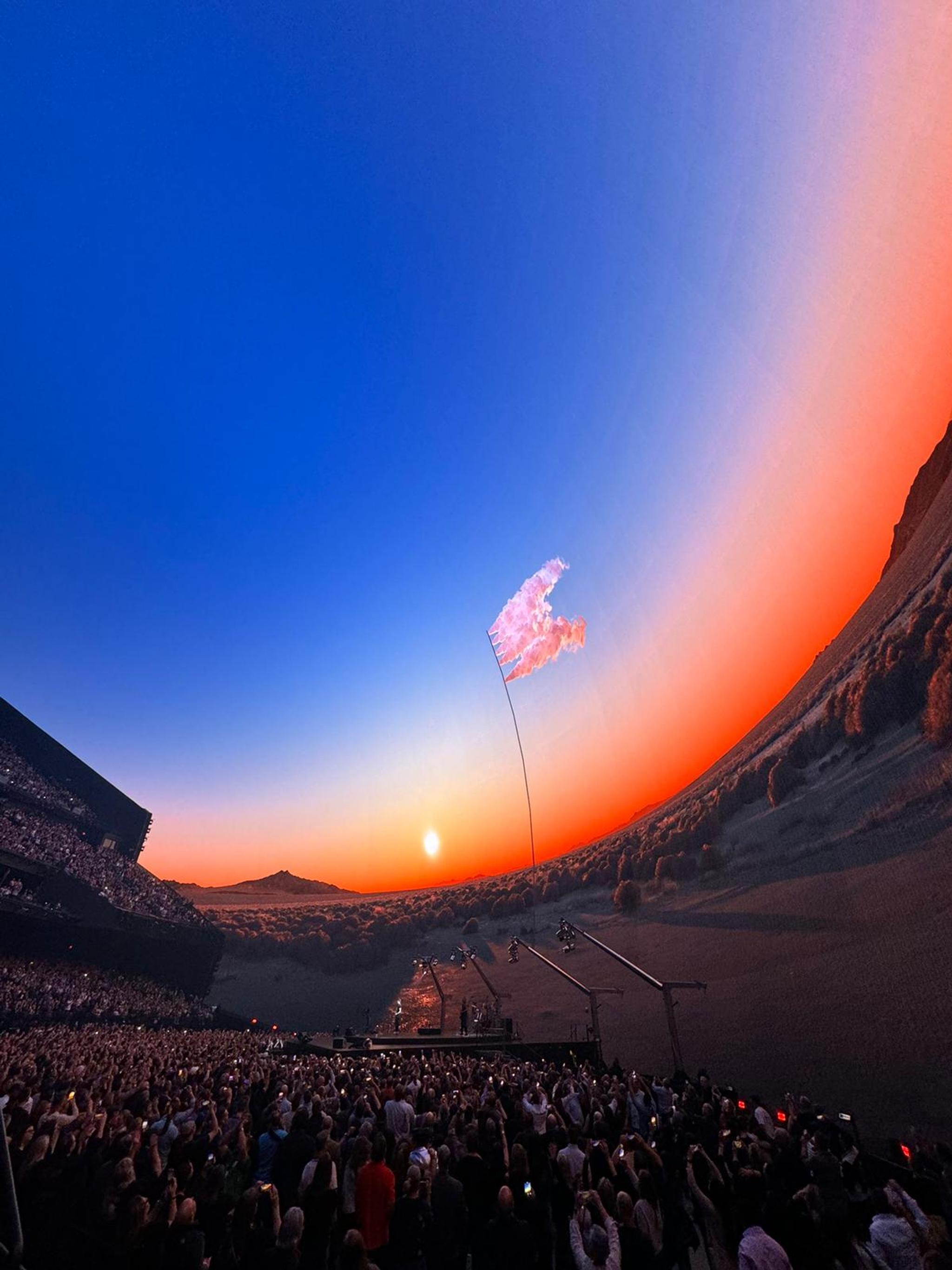 The interior of the U2Dome shows viewers a virtual desert landscape with a sunset in the sky