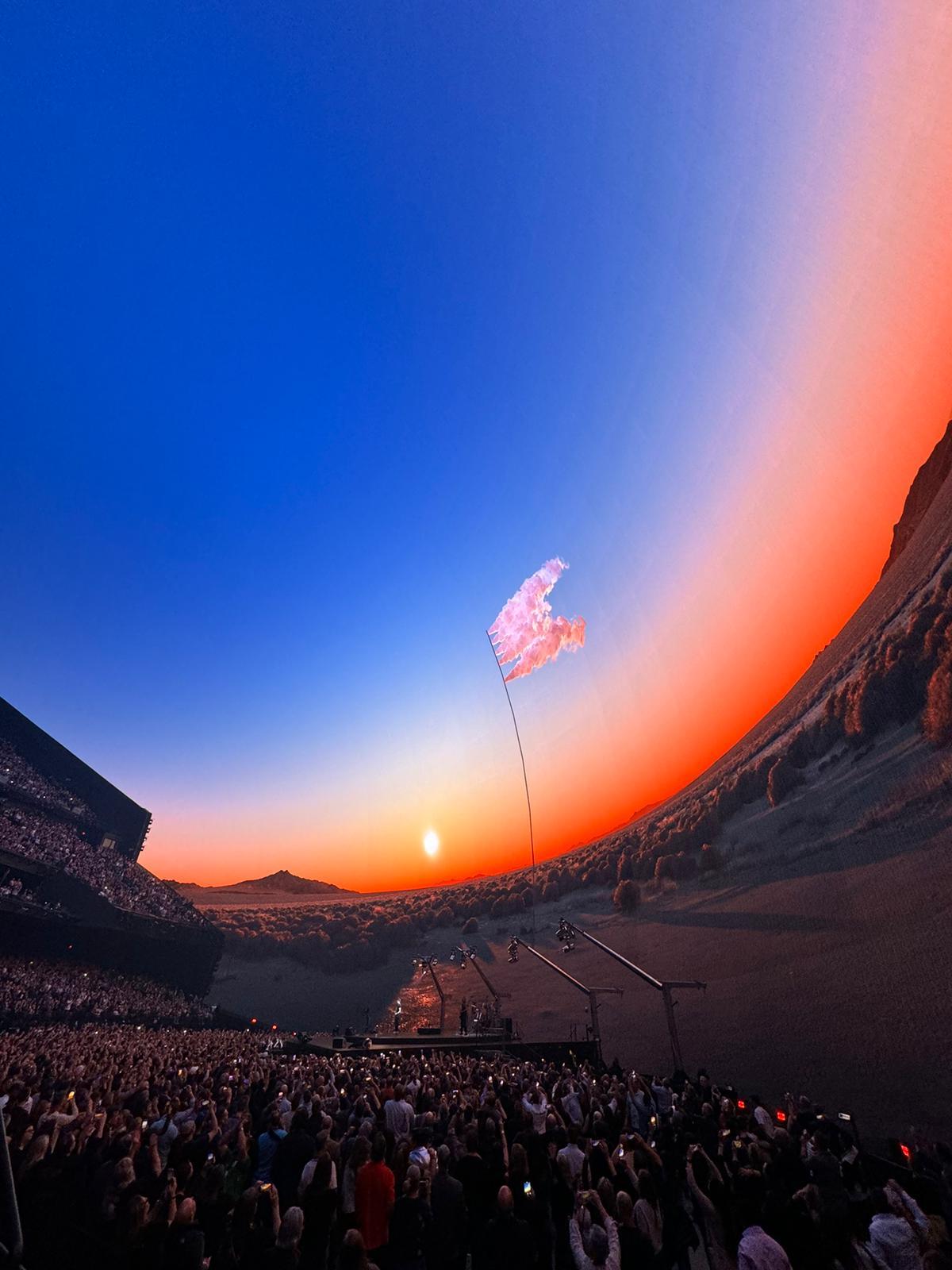 The interior of the U2Dome shows viewers a virtual desert landscape with a sunset in the sky