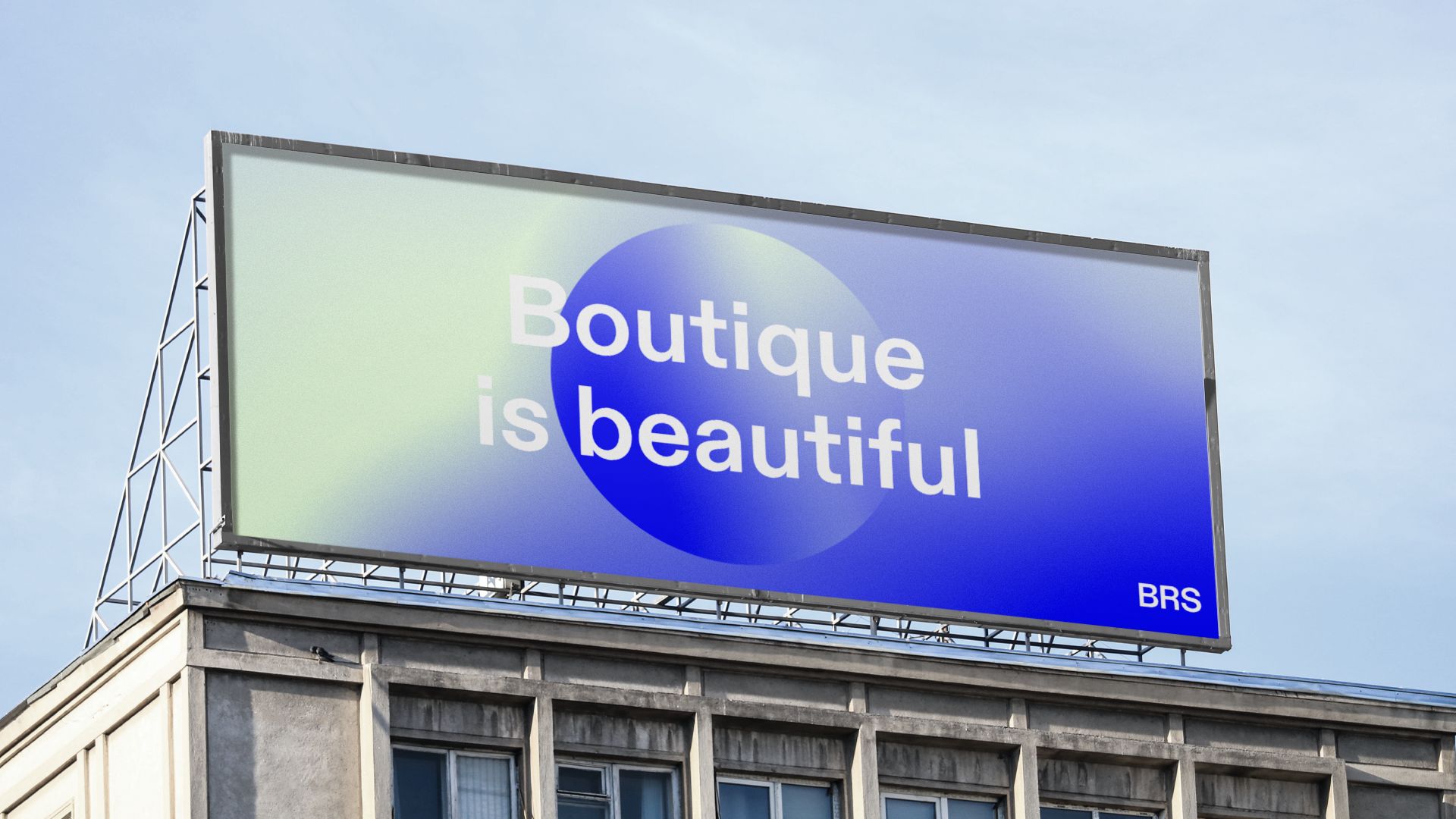 A billboard showing a blue/mint gradient and the statement "Boutique is beautiful"
