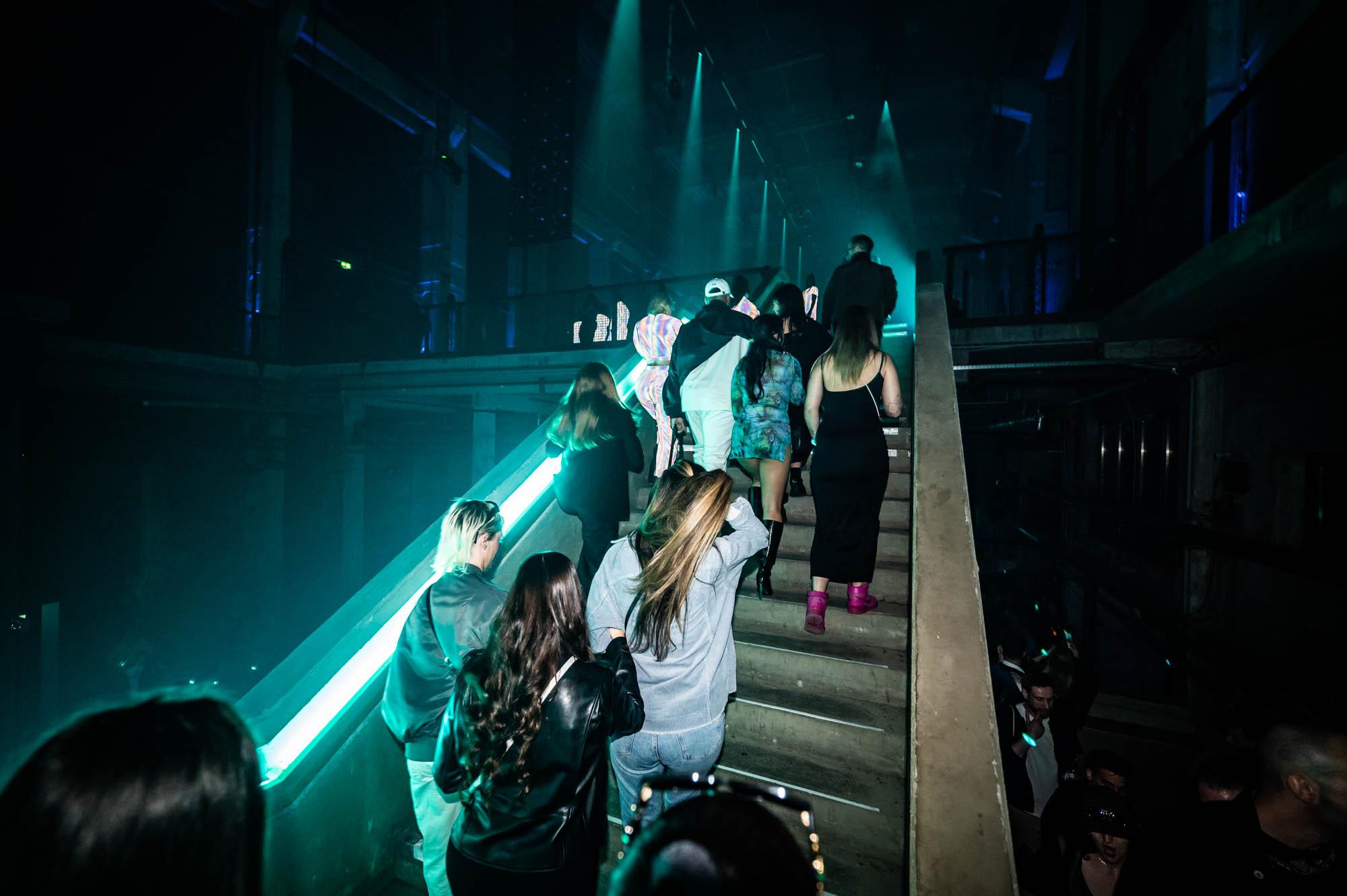 People walking up the stairs at Battle Royal Studios event for a fortune 500 client in Berlin's Kraftwerk to enter the next level