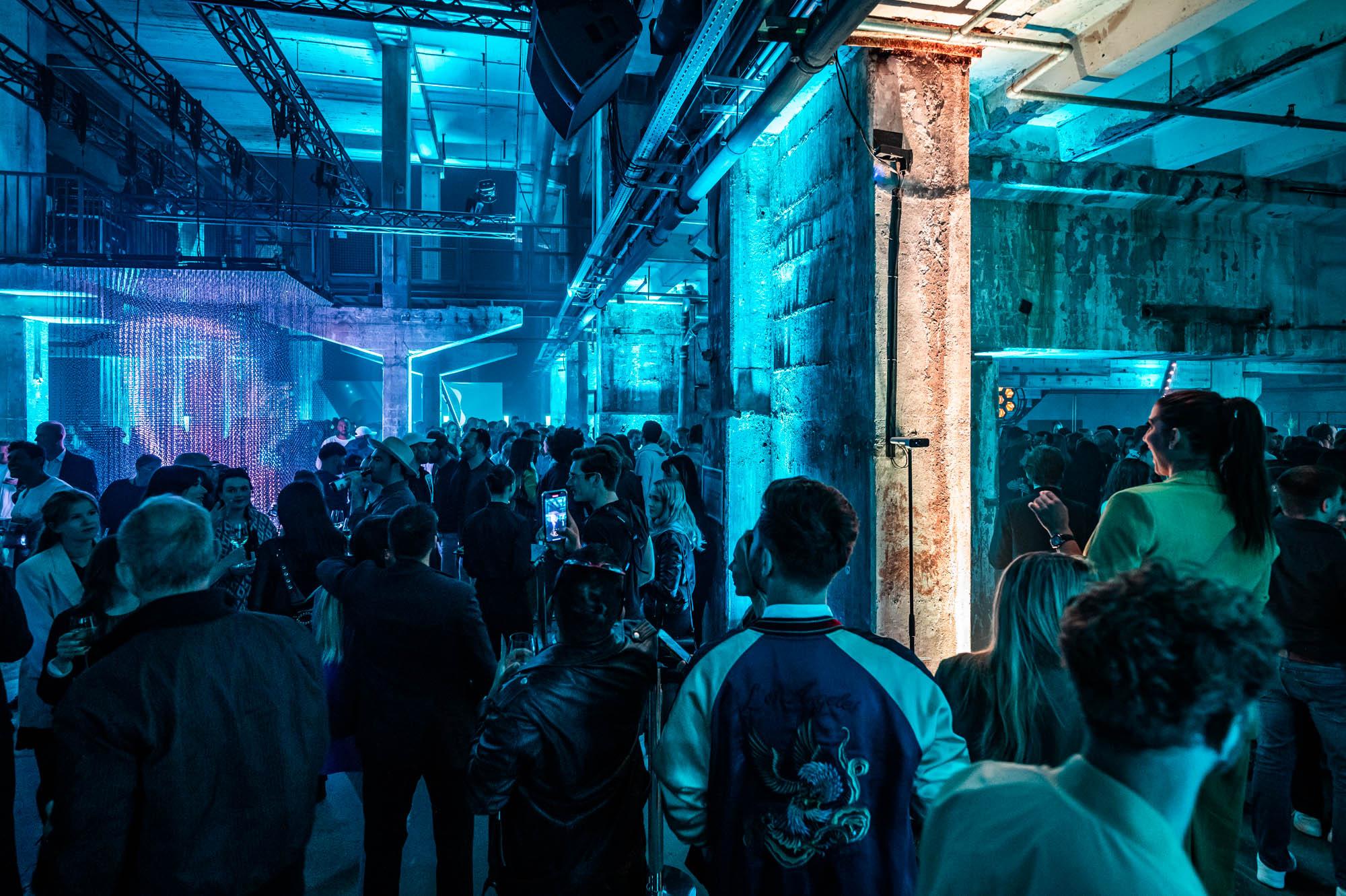 People standing in front of a immersive installation at the Battle Royal Studios event for a fortune 500 client at Berlin's Kraftwerk