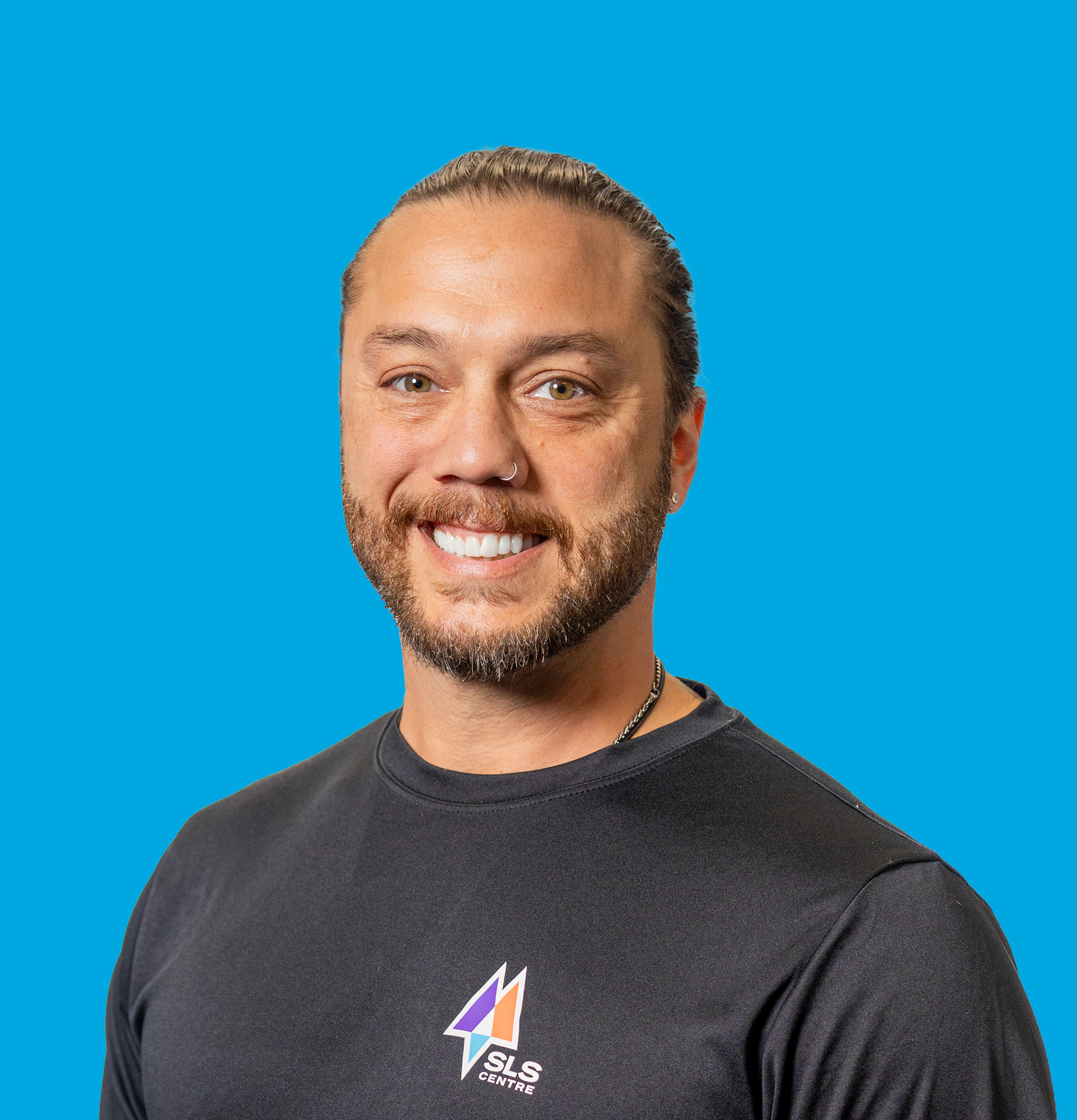 A profile photo of a male personal trainer smiling.