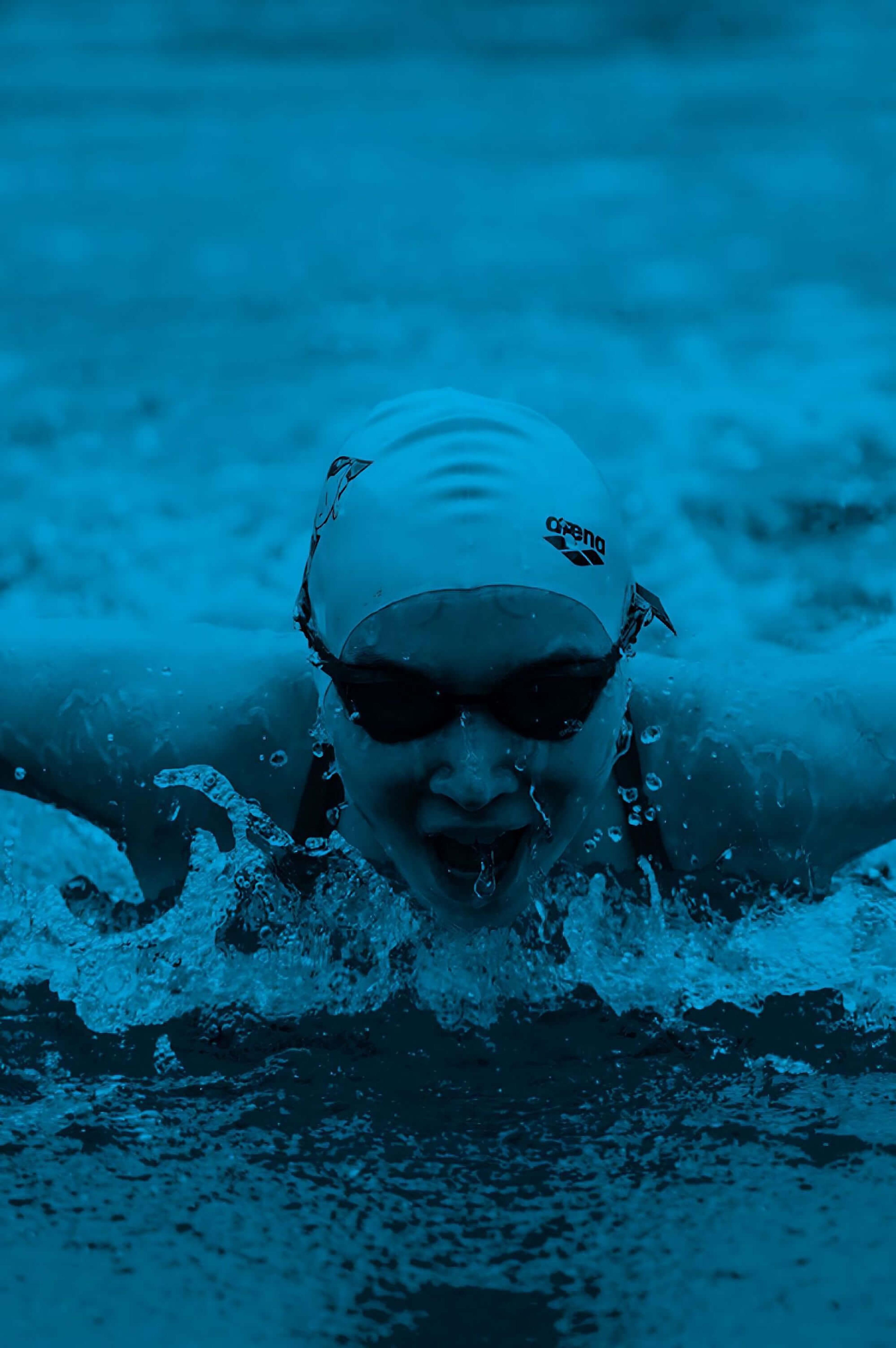 A person swimming, with a blue overlay.