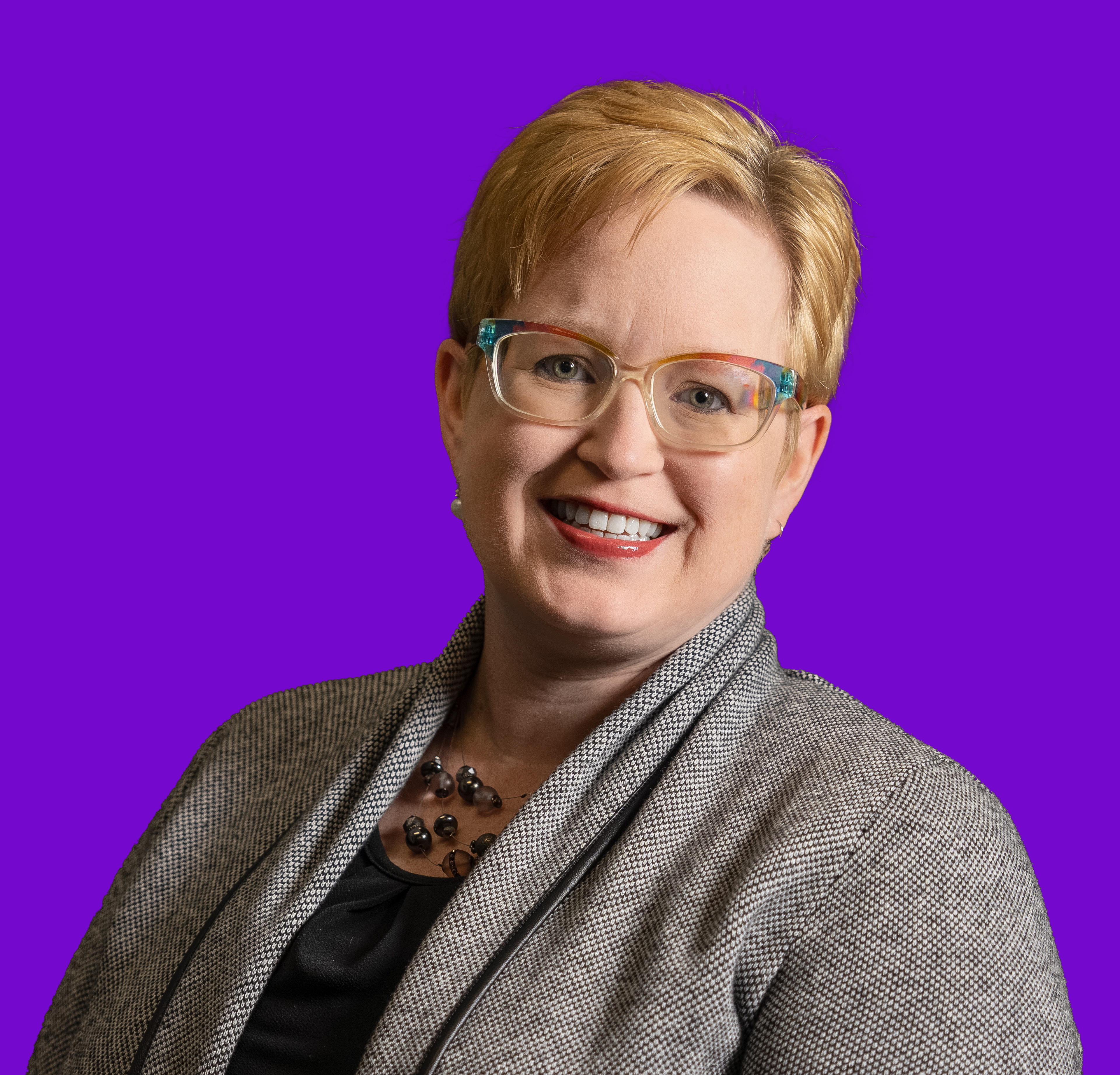 Profile image of Jolee Coulter on a solid purple background.