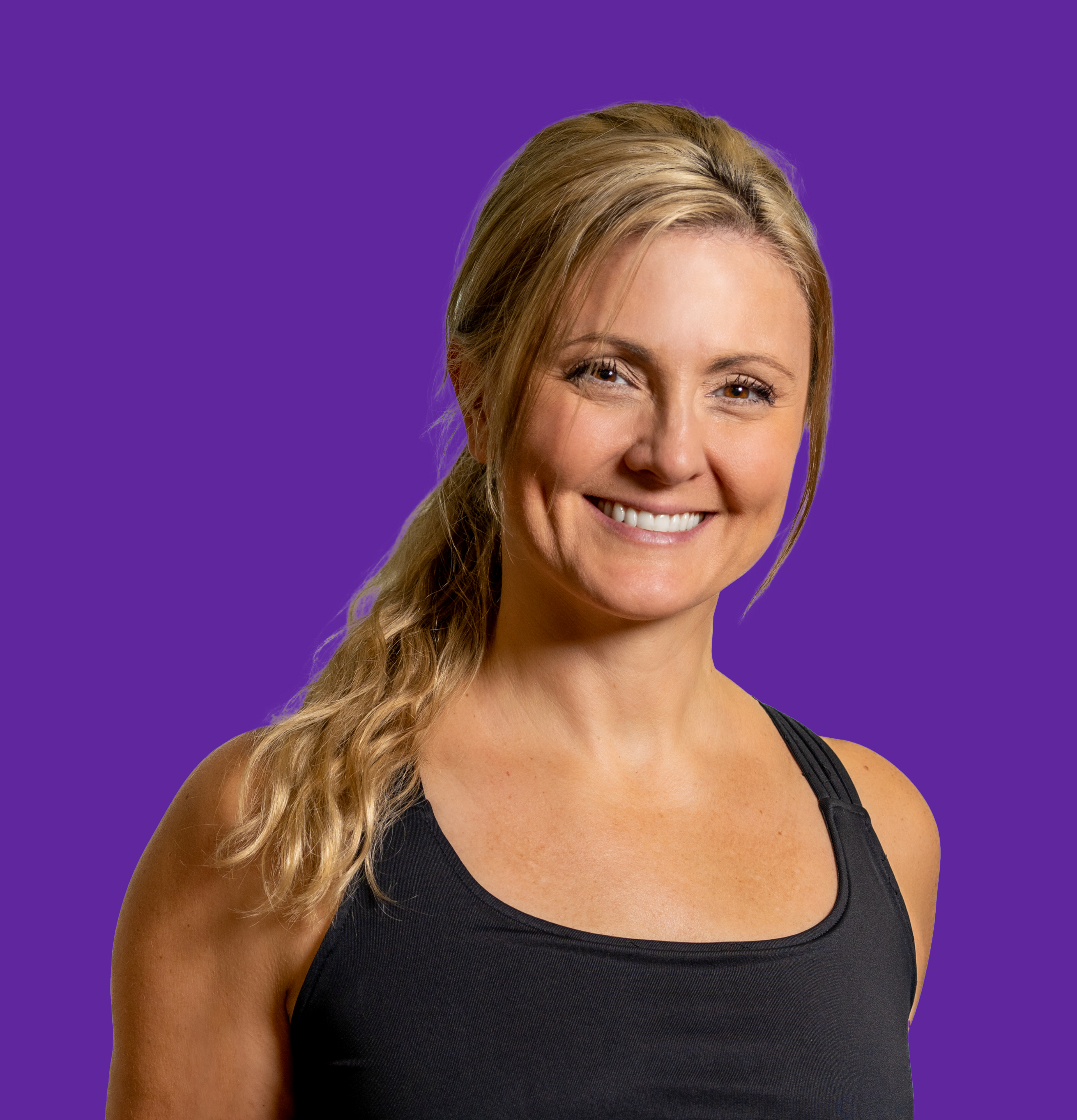 A profile photo of a female personal trainer smiling.