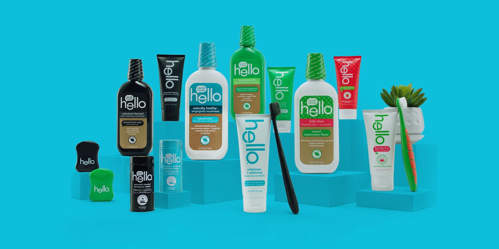 a lineup of hello's toothpastes and brushes in front of a blue background