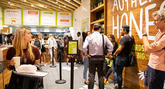 Many people wait in line to eat at holy chicken