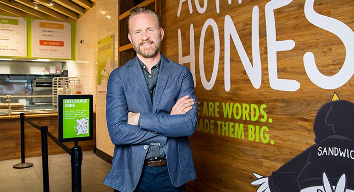 the owner of Holy chicken morgan Spurlock stands in his store in new york