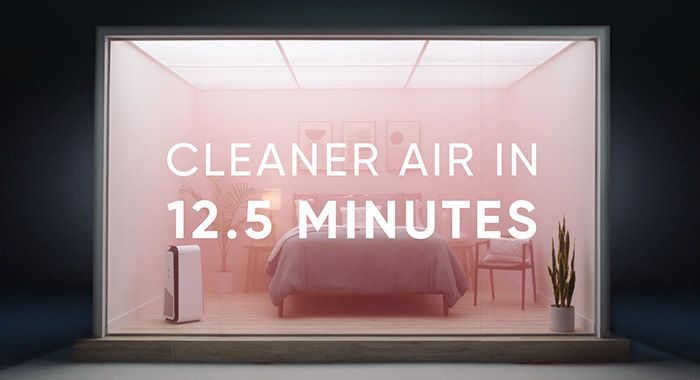 a set of a bedroom with pink dust being cleaned by the blue air purifier with text that reads, "cleaner air in 12.5 minutes"