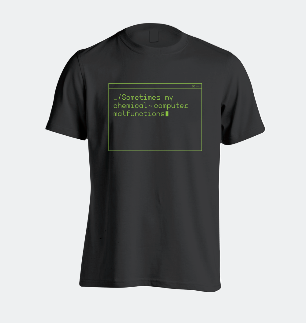 A black t shirt with a green computer window that says in code view, "Sometimes my chemical computer malfunctions"