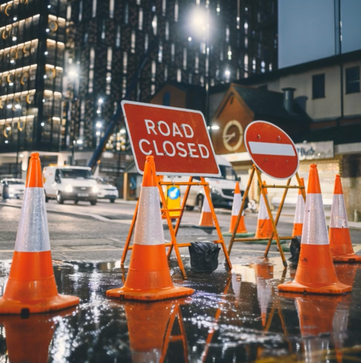 road closed temporary road sign at night