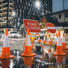 road closed temporary road sign at night
