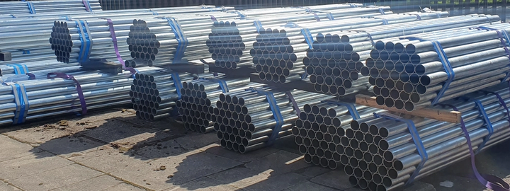 Road signs posts stored horizontally in bundles in wholesale storage
