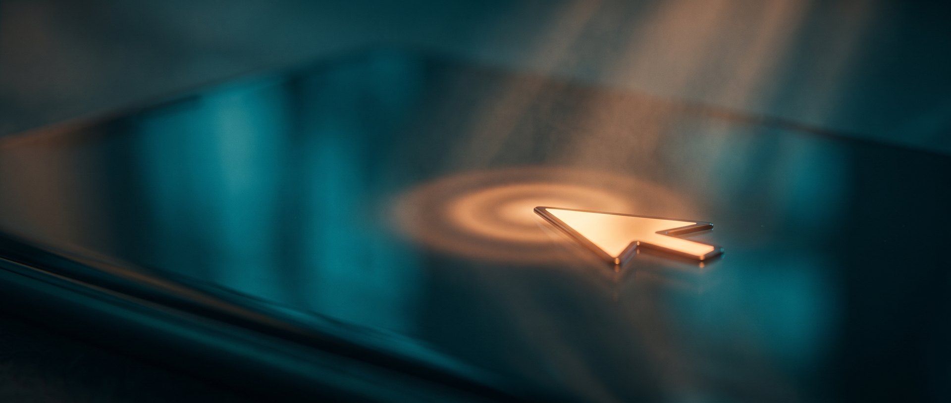 A glowing cursor arrow on a dark screen with a ripple spreading out from the point of the click