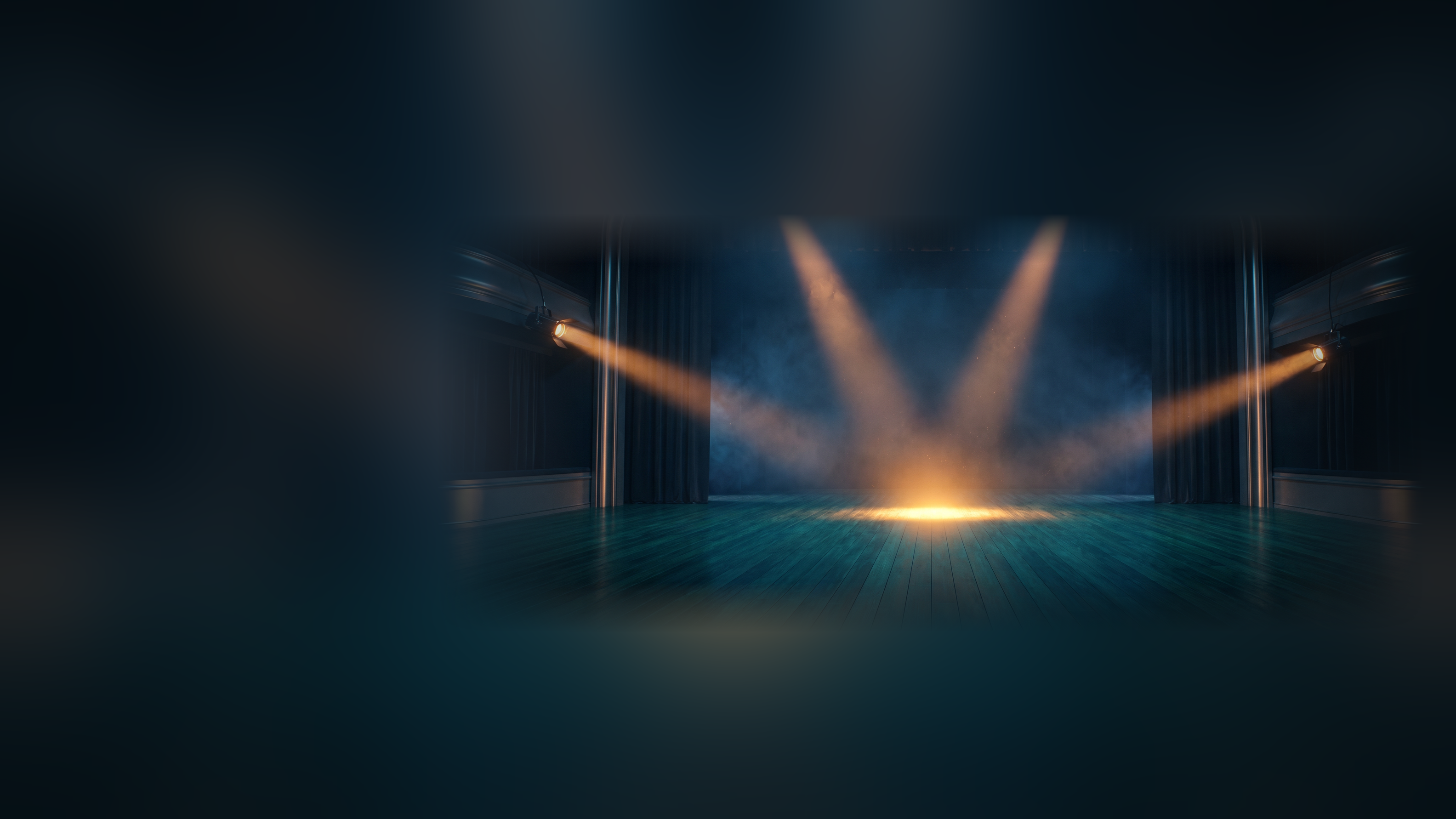 Three amber spotlights converging on one bright mark at center stage in a dark theater