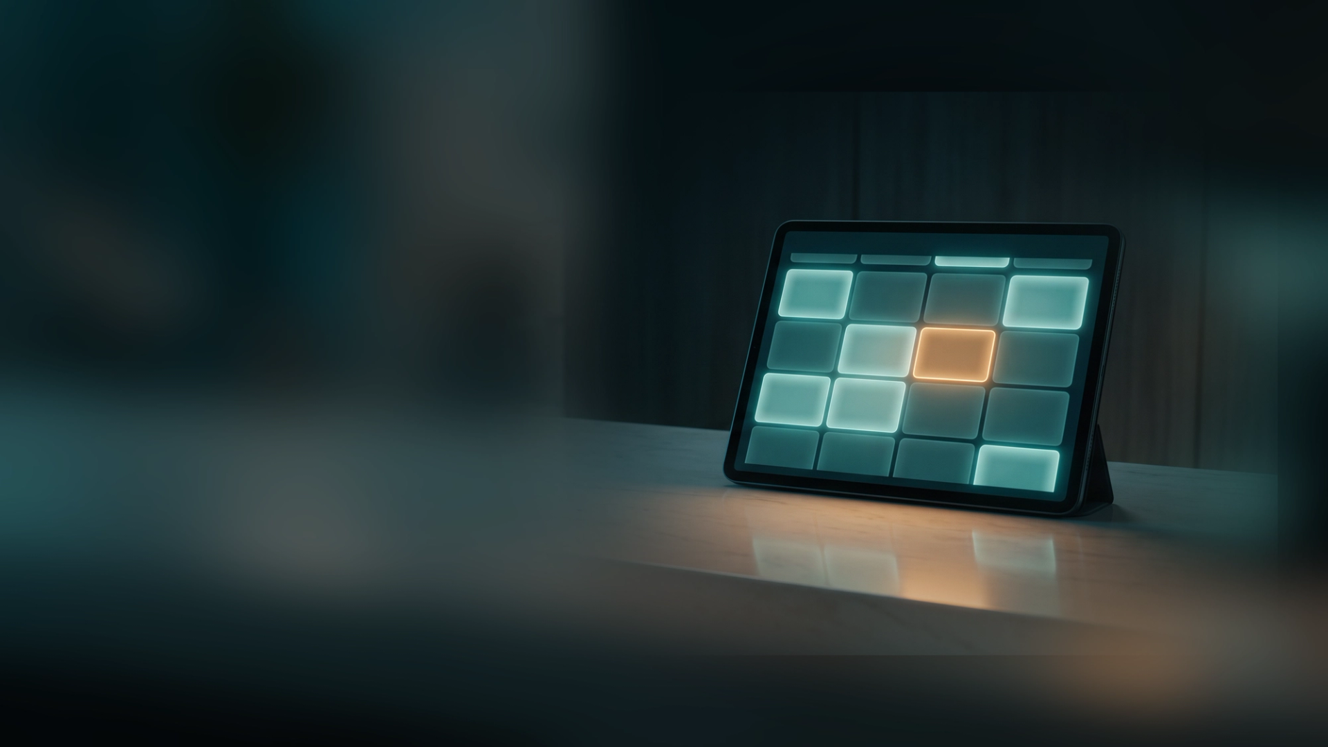 A tablet on a reception counter showing an appointment calendar, one newly booked time slot glowing amber