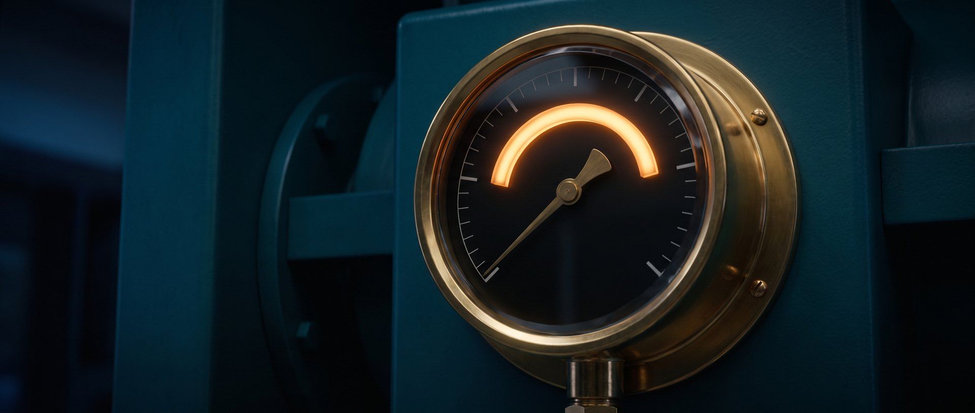 A brass pressure gauge with its needle resting below the lit amber safe arc