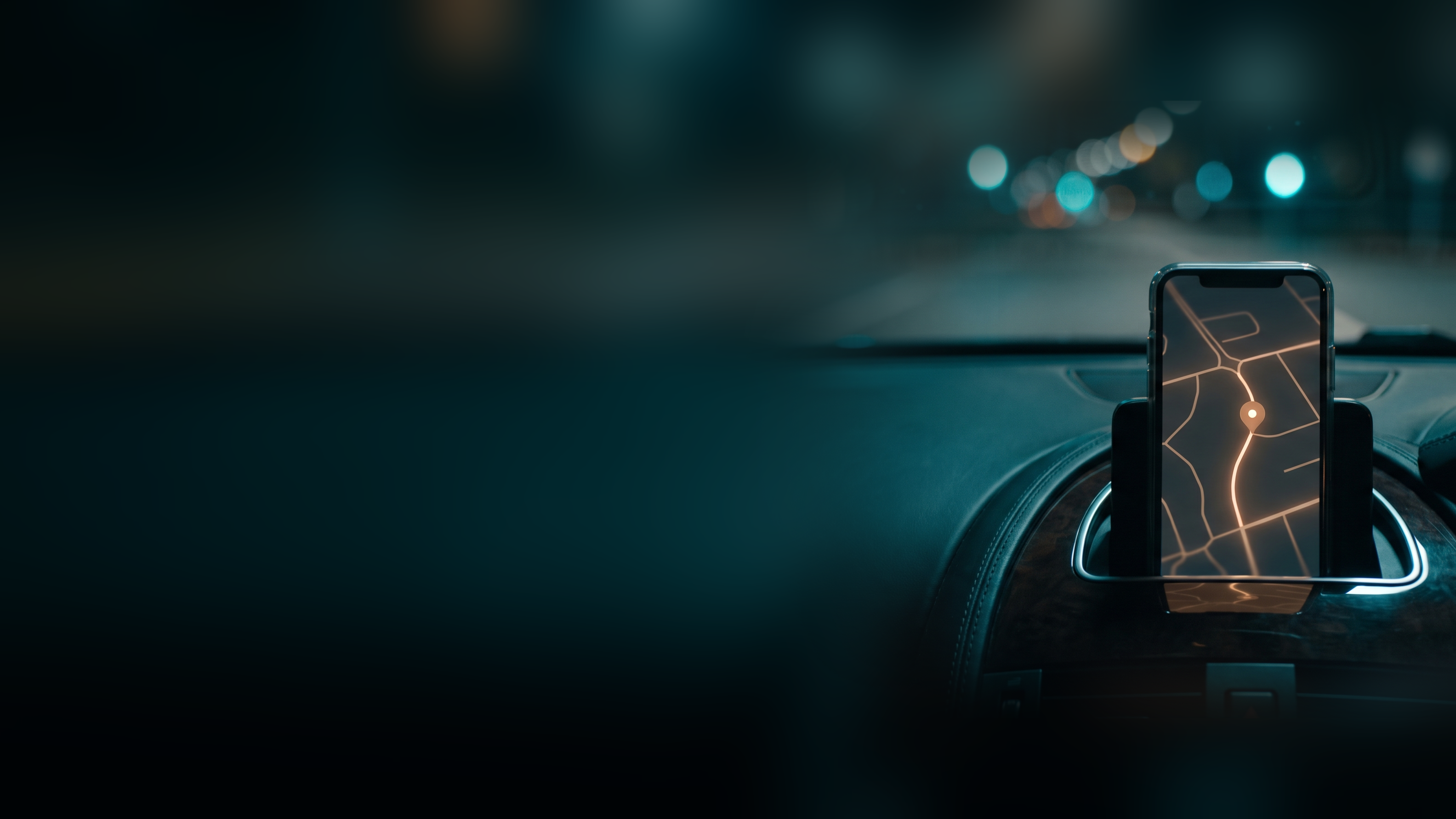 A phone on a car dashboard at night showing a map with one glowing destination pin a short drive ahead