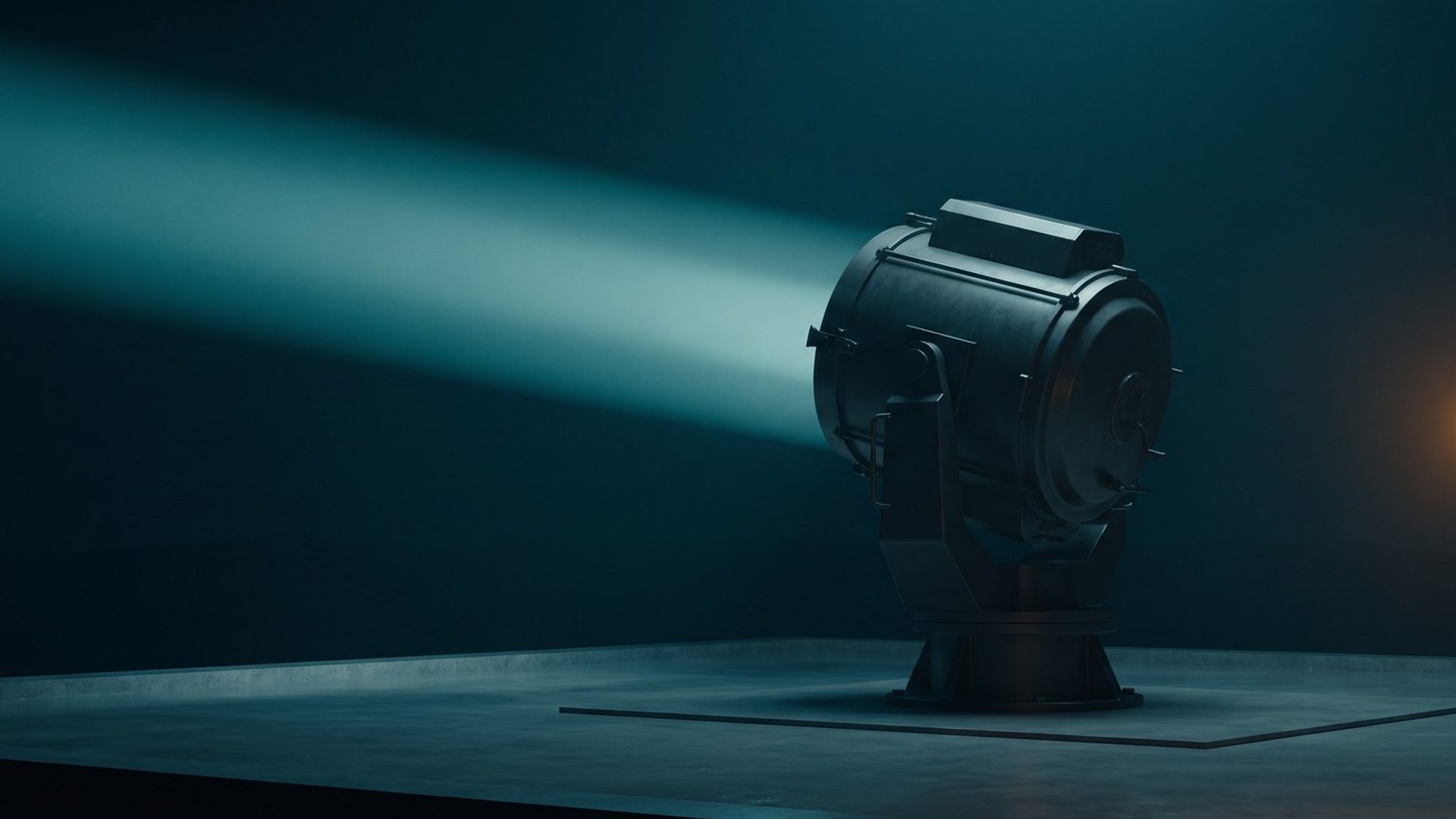 A searchlight throwing a wide beam past a small lit lantern in a dark room