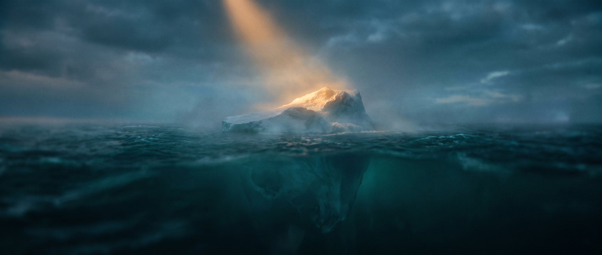 A lone iceberg at dusk, its small amber-lit tip above dark teal water and a vast shadowed mass hidden below the surface - the visible number versus the hidden reason your analytics can't show you.