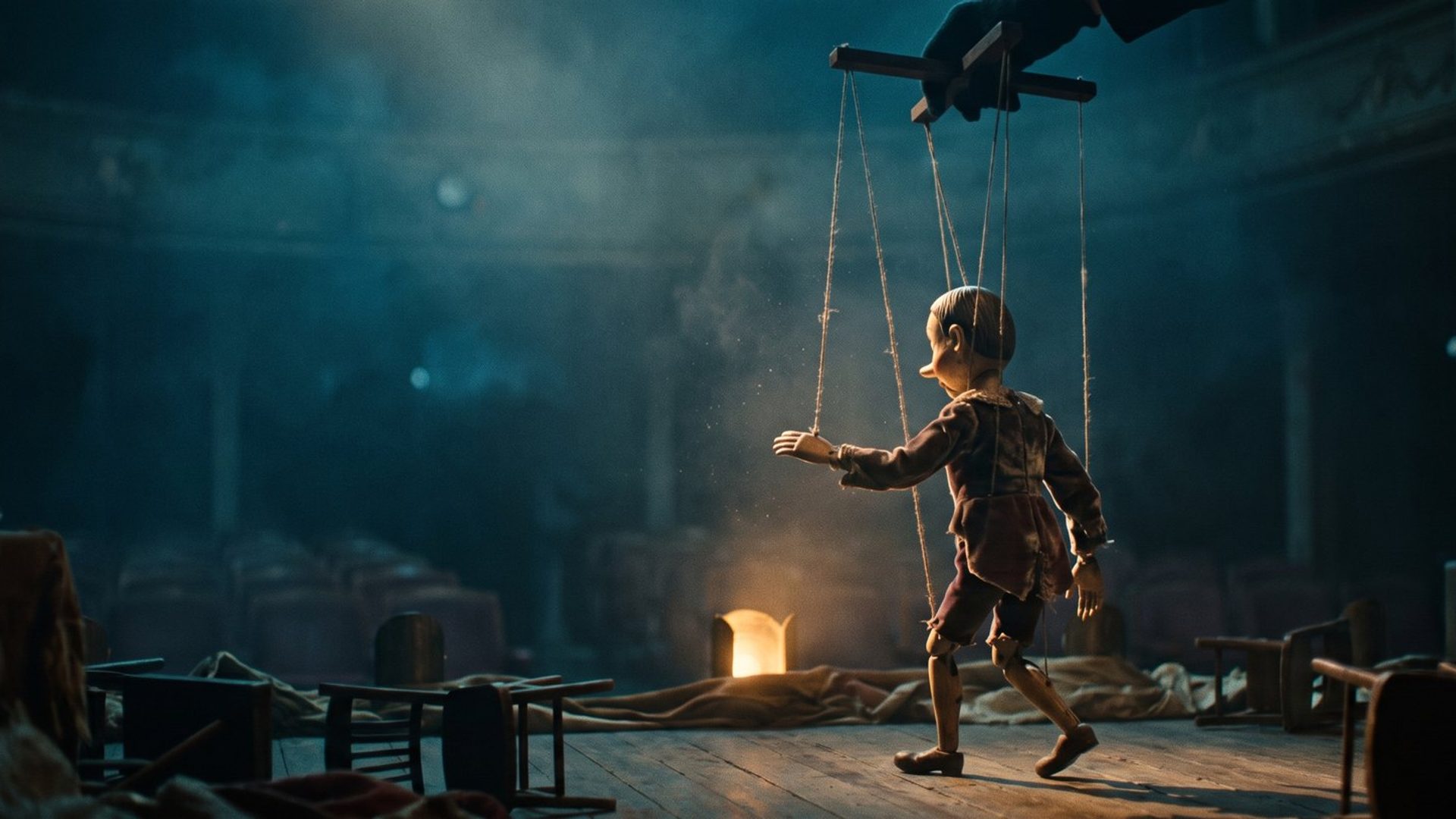 A wooden marionette performing on a dim stage, its strings running up to an unseen hand above
