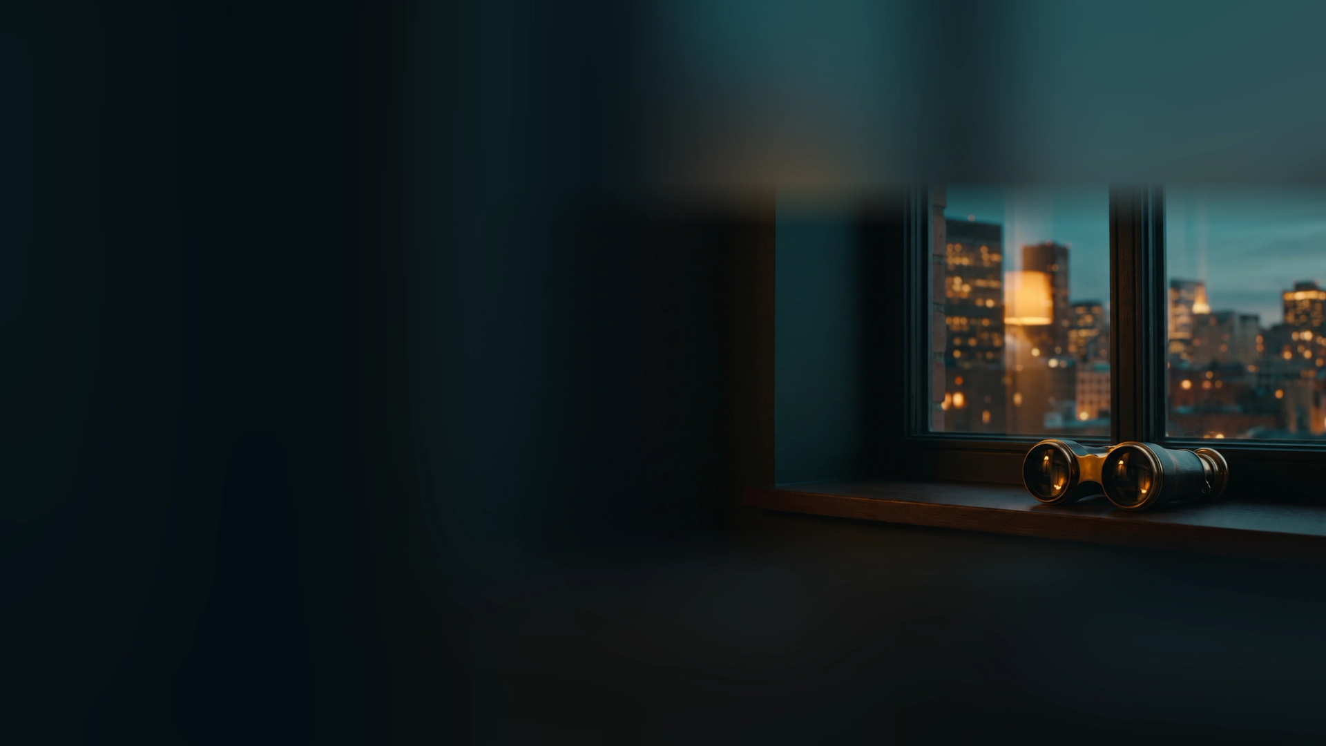 Brass binoculars on a dark windowsill facing a lit city skyline at dusk