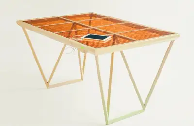 Solar Powered Current Table, a piece of furniture that is also an energy source