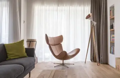 The Beauty of Minimalism: Concrete, Oak Wood, and Leather Accents in a 100 sq m Bucharest Apartment Design