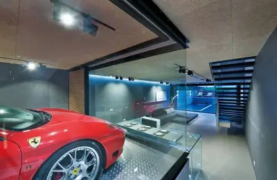 The Extravagant Design of a House with a Ferrari in its Center