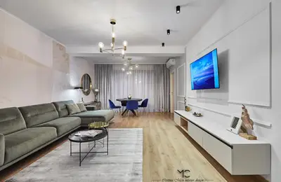 Modern Three-Bedroom Apartment with Neutral Tones and Vibrant Accents