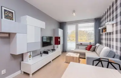 Modern Apartment for a Young Person with Red Touches