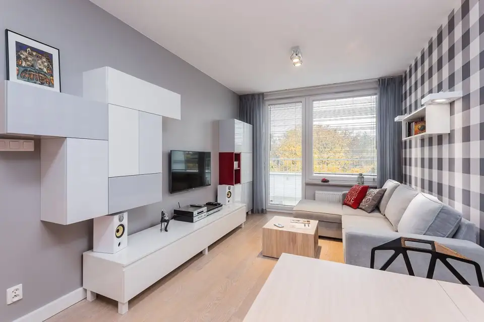 Modern Apartment for a Young Person with Red Touches