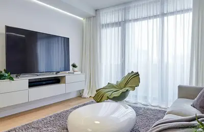 Natural Elegance in a 3-Room Design: Lots of Wood and Warm Gray Tones