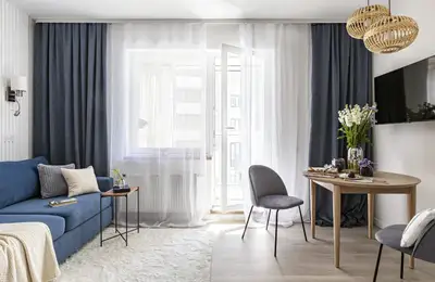 Bright 31 sq m Studio Decorated in Neutral Tones with Blue Accents