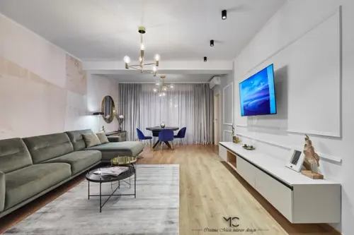 Apartament de trei camere modern amenajat in tonuri neutre cu accente de culori vibrante