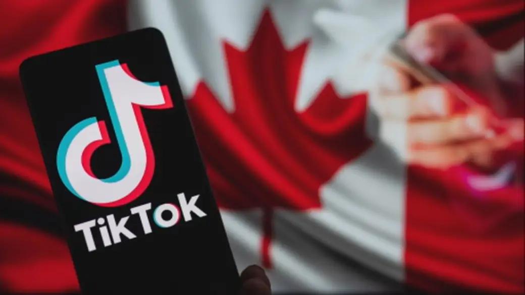 TikTok logo on a phone in front of a Canadian flag