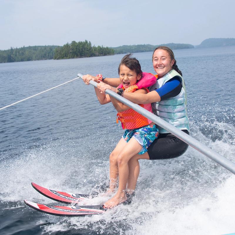waterski coach with young camper