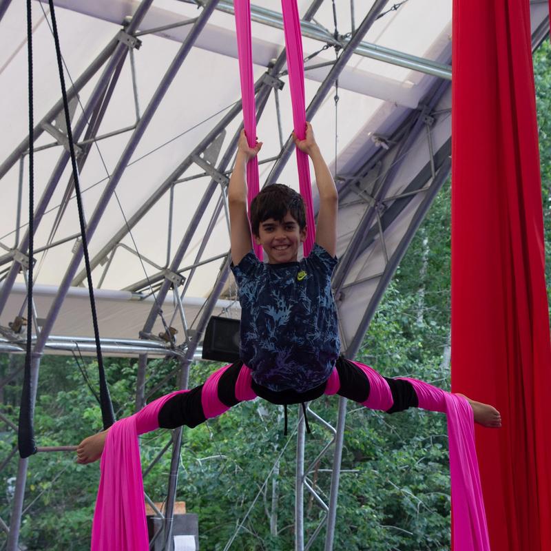 Camper on the silks training in the aerials program at Canadian Adventure Camp