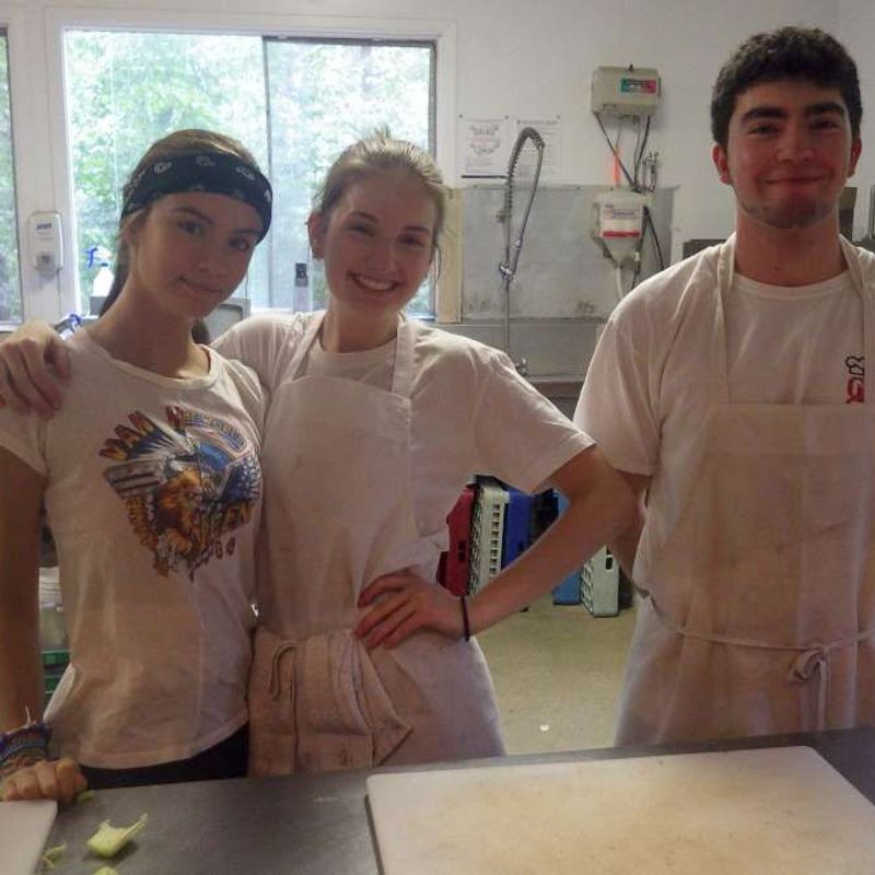 Kitchen staff smiling at the camera at Canadian Adventure Camp