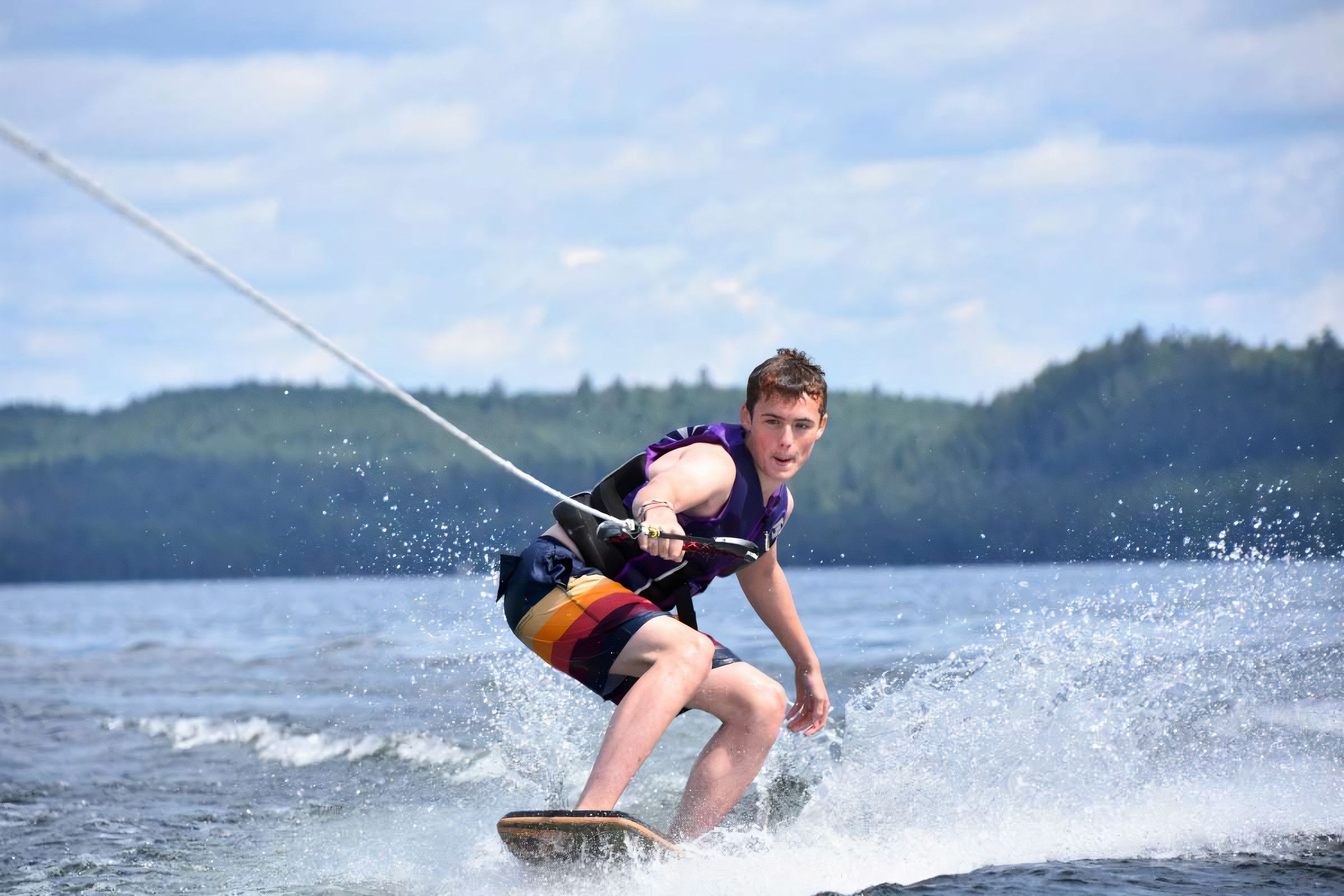 teenage camper wakeboarding at Canadian Adventure Camp