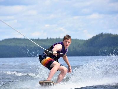teenage camper wakeboarding at Canadian Adventure Camp